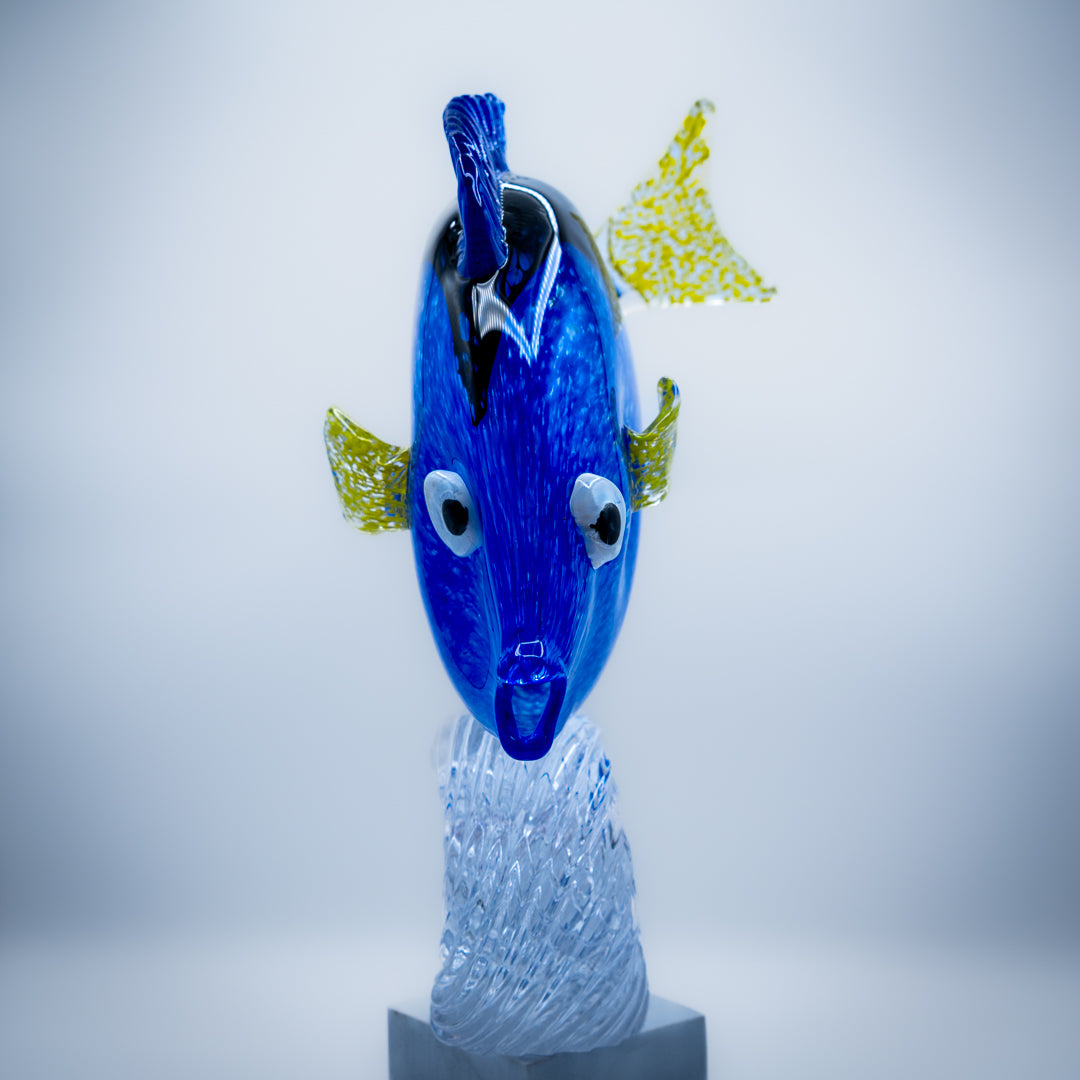 Regal Blue Tang Fish riding a wave